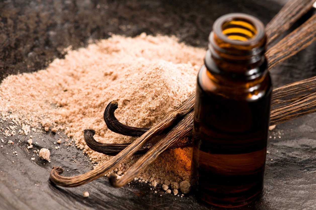 Vanilla with bottle of essential oil
