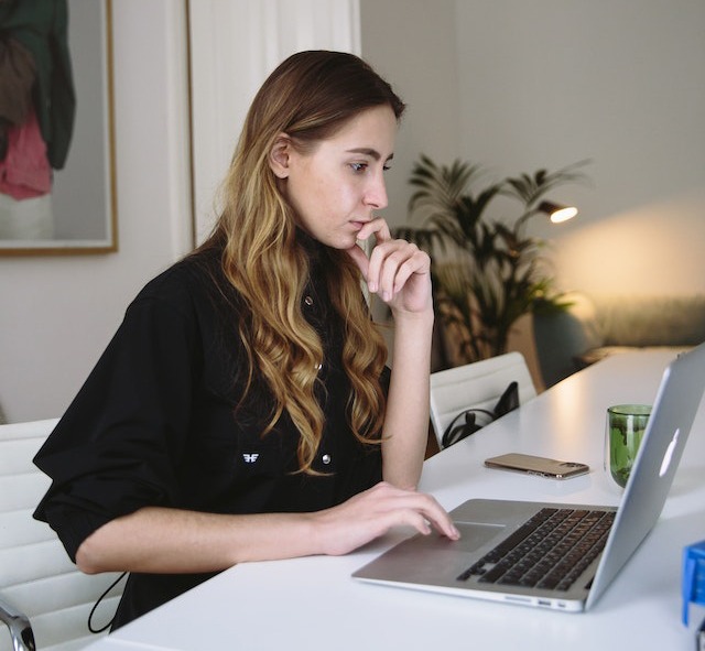photo of woman using laptop