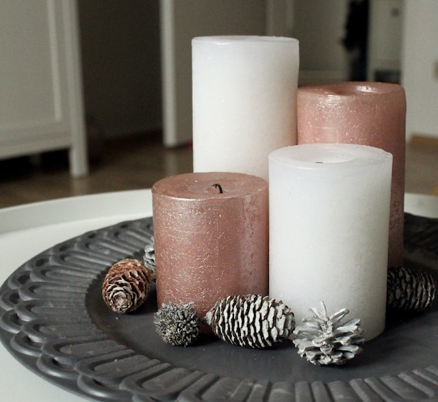 white and brown pillar candles